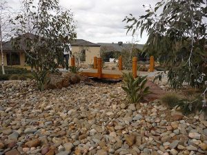 Pebbled Dry Creek Bed And Bridge